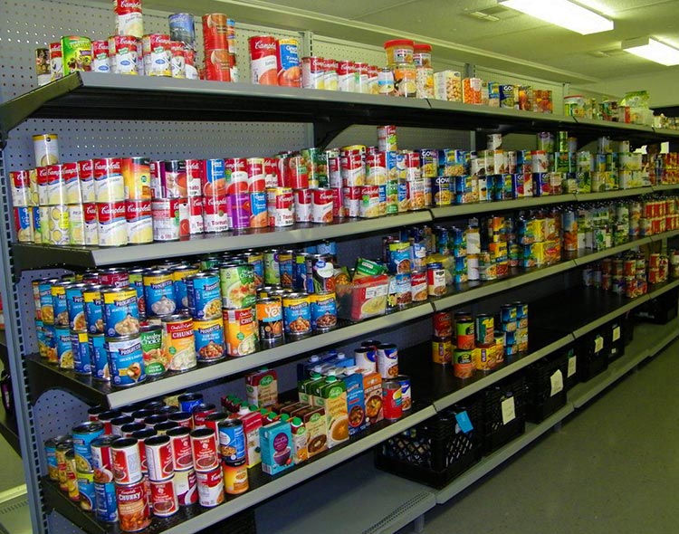Canned goods displayed on a shelf at the Dunedin Cares Food Pantry